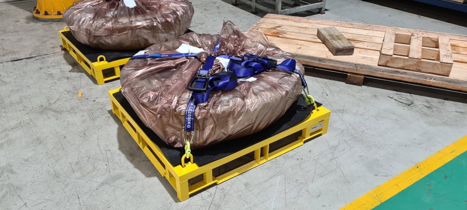 equipment secured on a steel pallet