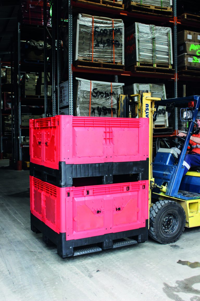 forklift carrying collapsible bin