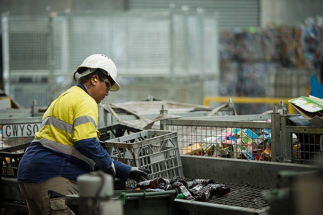 woman collecting bottles