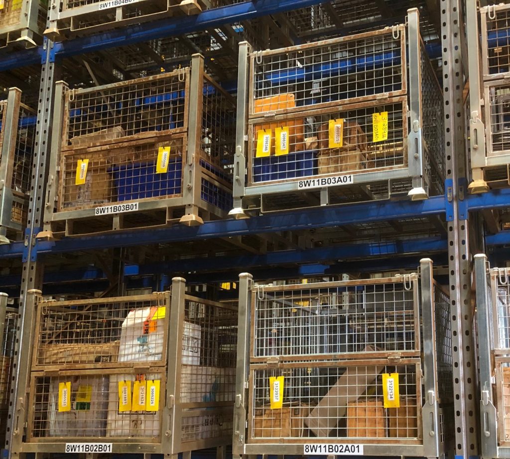 rows of steel pallets in warehouse