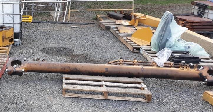 heavy metal pipe placed on timber pallet 