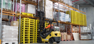 Forklift driver in warehouse