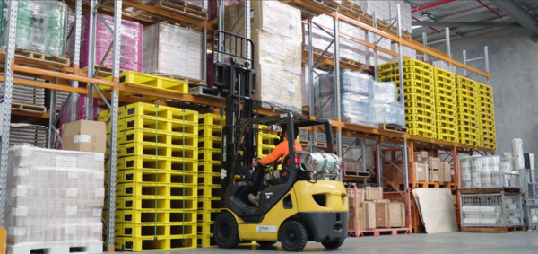 Forklift driver in warehouse