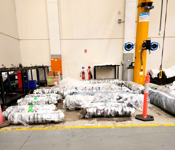 Crankshafts in wrapping and left on the floor of a workshop