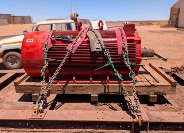 large mining equipment component strapped to failing pallet