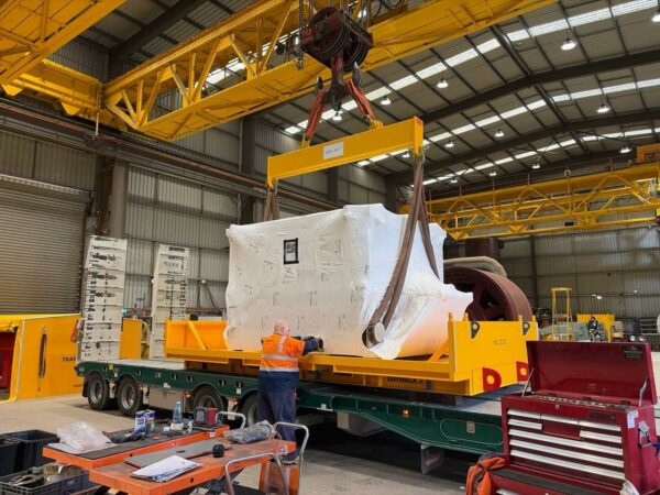 Large motor required for shutdown install being loaded on a track with DAYWALK transporter frame.